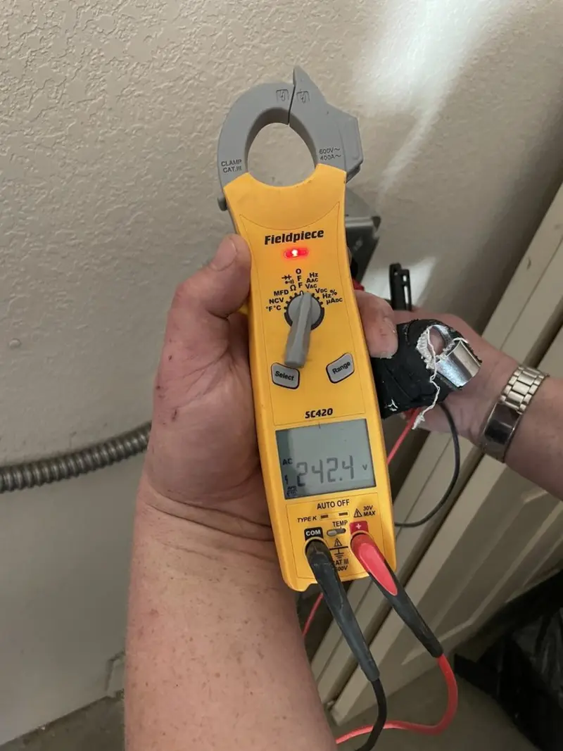 Voltage testing with clamp meter during Recessed Lighting Installation in Telford